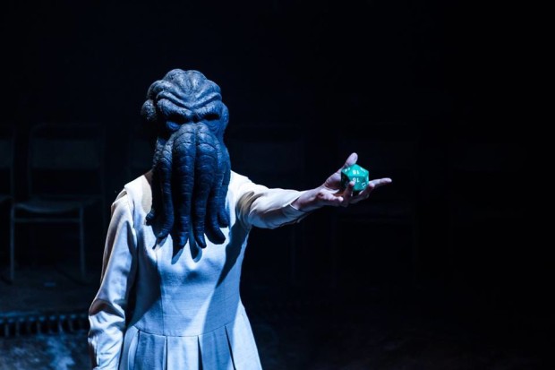 Sarah Middleton dons the mask of Chtulhu in Alistair McDowall's Pomona at the National Theatre. Photo by Richard Davenport.