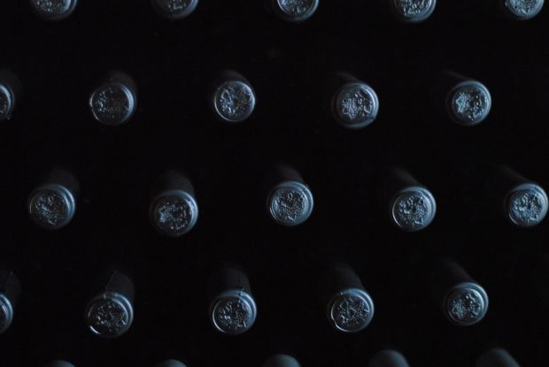 Wine bottles, corks facing