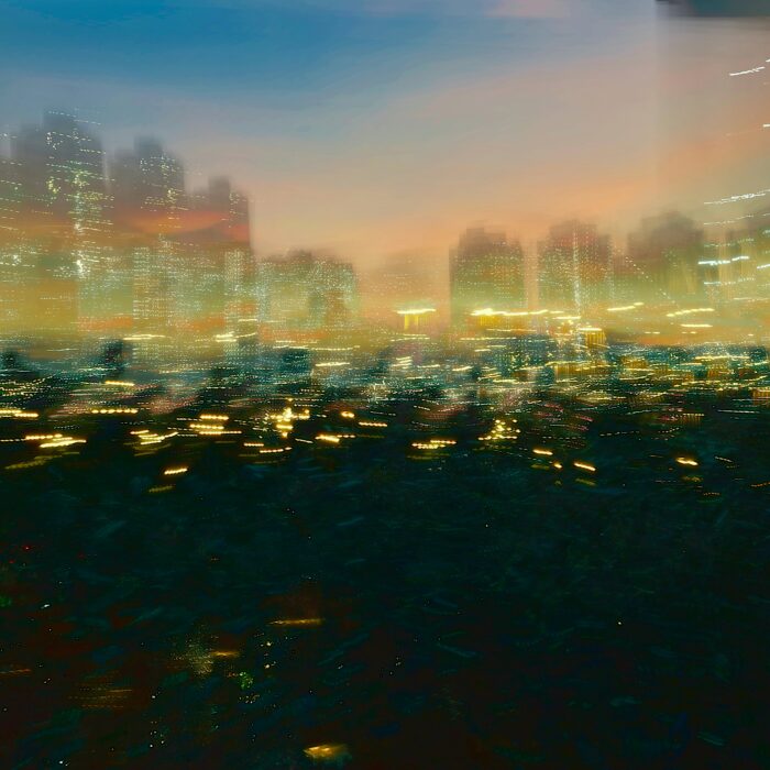 Abstract blurred cityscape evoking the journey into Budapest.