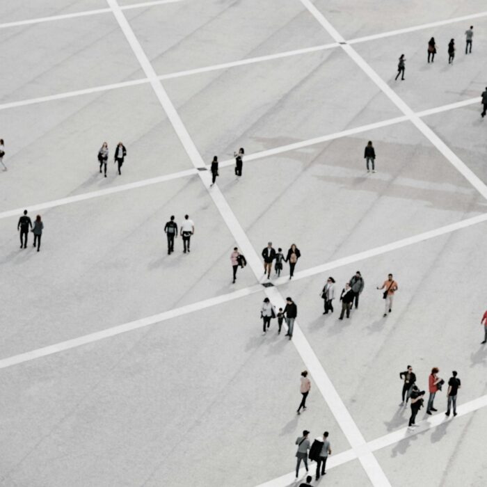 Quiet public square or street scene suggesting social observation and informal authority